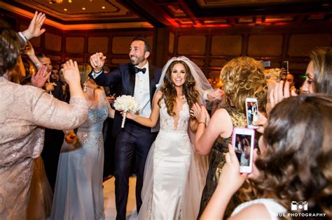 The bride releases the female dove, while the groom releases the male. . Chaldean wedding reception traditions